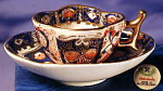 Occ. Japan Hokutosha h.p. quatrefoil mini c&s. Porcelain.  Occupied Japan.  1945-1952.  Fabulous! Wonderfully hand painted in cobalt, peach & burnt orange (iron-reds) & gilt (lots of it) on white grou...
