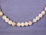 Yellow Jade & Pewter Necklace. Light Yellow Jade 6mm beads and Bali style pewter spacer beads lend a springtime feel to this necklace. Approx. length: 22 inches.