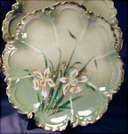 RS Prussia Narcissus cake plate 2. Porcelain. Germany. Unmarked, R.S. Prussia.  c. 1900s.  (RSP Mold 256) 1 of set of 4. Relief molded in the form of a flower with 8 petals. Pale green, very high lu...