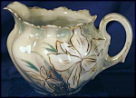 RS Prussia Narcissus creamer. Porcelain. Germany. Unmarked, R.S. Prussia.  c. 1900s.  (RSP Mold 256). Beautifully molded. Pale green & white very high luster, with white narcissus & touches of yellow;...