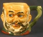 Toby pitcher of a portly gent with a beard. About 3 inches tall. Back stamped "Made in Occupied Japan."