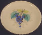 Salad plate with grape decoration in the long-running Westmoreland Pattern #22 (called "Beaded Edge" by collectors). Approximately 7 3/8 inches in diameter. Excellent condition.