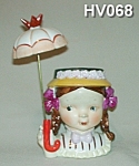 This unusual Little Umbrella Girl Head Vase is 5" tall (8" tall with it's original umbrella). Like all the others, this one is very difficult to find with it's original umbrella! It is stamp...