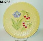 This very appealing Majolica "Iris and Cherries on Basketweave" Plate is 11 1/4" in diameter.  Stamped on the back is, "Made in Germany". Incised on the back is, "2897&qu...