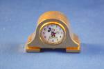 THIS IS A GREAT MINIATURE DISNEY CLOCK. IT IS BEAUTIFULLY MADE BY LINDEN. IT HAS A PLASTIC DOME.IT NEEDS A NEW BATTERY.IT IS 1 3/4 INCHES ROUND AND 2 3/4 INCHES HIGH.  I HAVE HAD IT FOR AT LEAST 10 YE...
