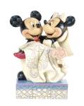 Mickey and Minnie get hitched! A tux-clad Mickey carries Minnie over the threshold in this heartwarming design by Jim Shore. Shore's distinctive folk art style is evident in details like the checkered...