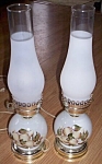 This is a nice set of lamps. They are newer but pretty. Milk glass bottom has a hand painted<BR>yellow tea rose pattern. There are scratches to the pattern. Both come with a globe. Both in<BR>working ...