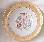 Wonderful old piece of porcelain made in Japan, marked in red. Peach luster rim with a hand<BR>painted floral center. I assume with the pierced rim it was once a basket. Still usable and<BR>beautiful ...