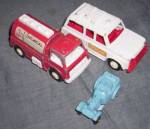 Set of three old Tootsie Toy cars. We have the 1970s Fire Truck and Rescue Truck. Also an older Jalopy in blue. Some minor wear to the paper decals on the 70s toys. Great set.