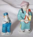 Neat little Dutch boy and one oriental man playing something. Both marked Made in Occupied Japan. Both in excellent condition. Tallest stands 4 " tall.