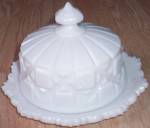 Lovely old round covered butter dish from Westmoreland Glass. This is their 1940-1984 pattern Old Quilt. It has both top and bottom with the lid being marked inside. Set is in excellent condition. Sta...