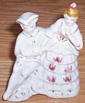 Nice small piece of Occupied Japan. Features a porcelain man and woman in period<BR>dress.Excellent condition. Stands 3 3/4" tall.<BR>