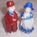 Pair of Dutch children figurine made of porcelain. Both are marked Occupied Japan. The girl has a repair to her stand at the far right of her. Did not affect her balance nor is it  distracting and onl...
