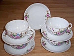 This is a wonderful set of egg shell porcelain made in Occupied Japan. We have 4 cups with a<BR>stunningly detailed rose and floral bouquet on one side. There are 5 saucers each with a single<BR>rose ...
