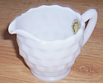 This is a creamer made by Hazel atlas Glass in the 50s. It was called Opaque Ware as it is not a<BR>stark white milk glass. This pattern is know as Early American Style or Cube by collectors. This<BR...