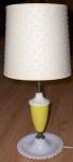 Kind of a neat old dresser lamp with the milk glass base in a candlewick pattern. The center<BR>yellow section is a plastic. The shade, which I believe is original, has a pompom texture of little<BR>f...