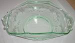 This is a stunning piece of old glass. It was made by Lancaster Glass in the 30s. It has a wheel cut 6 petal flower and leaf pattern. It is done in the soft green. It is in excellent condition. Stand...