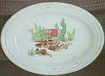 Featured for your enjoyment is a gorgeous little platter with a Mexican center theme. The rim is<BR>like over lapped wing tips. No markings but is sure is pretty. Excellent condition with one tiny<BR>...