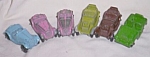 We have a set of 6 old Tootsie Toy die cast cars. We have two pink M.G. cars and a blue. Both<BR>pinks show wear, blue is excellent. We also have two Roadsters, one olive and one brown. Olive<BR>shows...