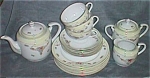 Featured for your enjoyment is a lovely porcelain 18 piece tea set from Occupied Japan. Marked<BR>MK. No idea. It has a lovely pastel yellow deco style rim with little flowers.  Such a snow white<BR>c...