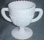 Featured is a lovely milk glass open sugar. It is marked with the I over G by Imperial Glass.<BR>Excellent condition with a grape and cable pattern The foot is encircled with lines. The top rim is<BR>...