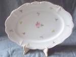 Stunning porcelain serving platter from Johann Haviland Bavaria Germany. It has tiny flowers scattered about with a slightly larger rose center. It is then trimmed on the scrolled rim with gold. It me...