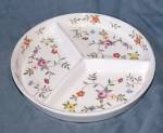 Lovely little relish tray from Takito of Japan. It is in excellent condition with only wear to the gold rim. It has a beautiful rambling floral pattern. It stands 1" tall by 7 " wide.