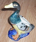 Adorable little planter shaped like a duck. Marked in a circle, Quality Japan. Textured body that<BR>looks like feathers. Bright colors. Excellent condition. Stands 6" tall.<BR>