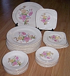 Great set of 50s dinnerware from Edwin M. Knowles China. This set has a stunning<BR>chrysanthemum pattern in pink and yellow. It was made in 1950 as it is marked 50-10 which<BR>gives the year. With t...