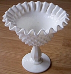 Lovely old piece of Fenton Art Glass. Milk glass crimped top hobnail pattern. Excellent<BR>condition. Pre logo era. Stands 6" tall by 5 3/4" wide.<BR>