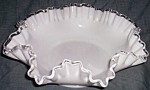 Lovely old double crimped bowl by Fenton Art Glass. This is their Silver Crest. A simple yet<BR>stunning piece of glass with the milk whate body and clear rim. Double crimped adds to this<BR>display. ...