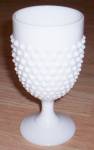 Pre 1970 Fenton Hobnail goblet in the milk glass. Excellent condition. Stands 6" tall by 3" wide.