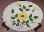 Wonderful pattern from Blue Ridge Pottery. This single bright yellow flower with 4 buds is the center piece of this pattern. Platter measures 11 " by 8 "  across.  Does have a tight hairli...