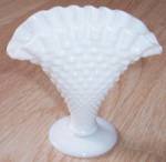 Adorable little milk glass fan vase by Fenton Art Glass. This is the hobnail with the crimped rim. It is in excellent condition. Stands 4" tall by 4  wide at the flare.