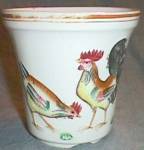 Featured is a very, very old pot or planter. It has  a hand painted rooster with his hen on the front and their chick on the back. Bottom is marked Hand Painted Japan in green. About 1930s. It has a ...