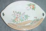 Vintage relish dish with a gold luster and hand painted flowers. Marked in red made in Japan. Stands 1 1/2" tall by 7 1/2" long by 5 1/2" wide.<BR><BR>