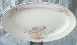Lovely platter by Edwin M. Knowles China. I think the transfer is Asters. Excellent condition. It is 13 3/4" long by 10 1/4" wide.
