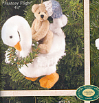 set of 2 is a 4.5 inch dark cream colored bear sitting on a goose.  The bear has a black stitched nose and mouth with a light blue and white cap.  The goose has wings and comes with a wreath around it...
