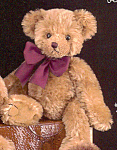 is a 10.5 inch light brown bear with a shaved muzzle, brown stitched nose and black eyes.  This soft bear wears a burgundy bow, comes with his Bearington hang tag and is in new condition directly from...