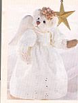 is a 13 inch white jointed angel bear with black shoe button eyes, a brown stitched nose, and light brown paw pads.  This sweet bear wears a long white eyelet dress with fabric wings and a halo made o...