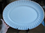 Vintage Anchor Hocking swirl platter. Large, white platter with gold trim. Raised mark on back: Oven Proof #x, (can't read the number), Anchor Hocking 2390 Made in USA. No chips or cracks, and is a bi...