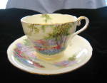 Lovely vintage Aynsley bone china teacup. Green backstamp. c:1930's. No chips or cracks. Saucer is 5.5 wide; cup is almost 3.5 wide x 2.5 tall. Gold trim with just a bit of wear off the gold on the ha...