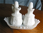 Vintage milk glass cruets and a tray. Very nice milk glass cruet bottles with paneled grape design and pontil marks on bottoms. No chips or cracks, and you get the little milk glass tray to set them o...