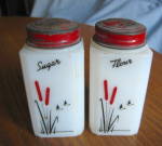 Vintage Flour & Sugar milk glass jars. Depression era. They are 4.25 tall x 2 wide. The glass is fine, the lids are missing some paint. 9/10brcs