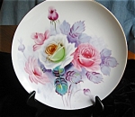 Occupied Japan display plate. c.1948-1953. This plate features pink and white roses. It is 8 x 8 inches and has no chips or cracks. Backstamp reads: AIYO China in a banner, Made in Occupied Japan; als...