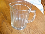 Vintage Hazel Atlas Glass milk pitcher. It has the Hazel Atlas symbol on bottom. No chips or cracks and is 6.25 tall x 5 wide x 15 around middle. Has some minor scratching, but is not bad. Age estimat...