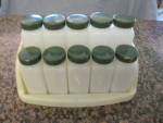 Vintage spice set. Green lids; milk glass jars. Jars are in good condition; no chips or cracks. Could use a more thorough cleaning. No labels on them; some of them just had some bits of labels that I ...