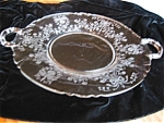 Large vintage Heisey Glass Orchid tray. c:1896-1957. Lovely etched glass platter with the Heisey symbol in center, (H in a diamond). Orchid pattern w/two handles, and no chips or cracks. Some minor we...