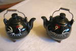 Vintage tea kettle shakers. Cute vintage shakers with rooster motif. One has remnant of a Japan label. One has a cork stopper; other stopper is missing. These are 3.5 tall with metal handle. 12/14