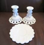 Milk glass candleholders. All three for one price! The round candle dish is a Westmoreland item and is marked on the bottom. The two other matching candleholders are not marked. All are in good condit...